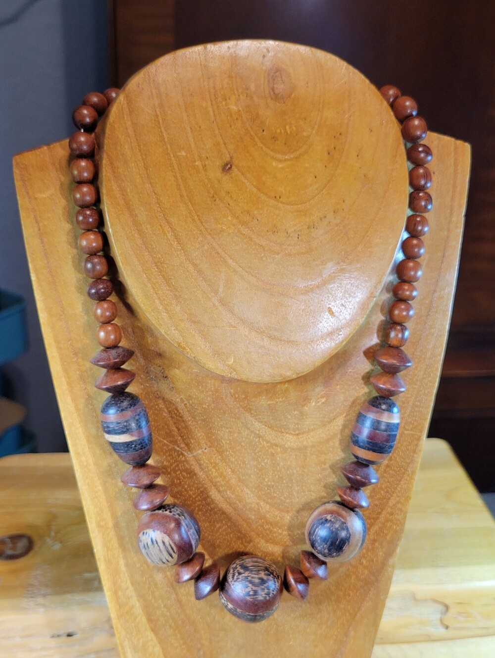 Handcrafted wooden bead necklace in warm brown tones. Natural wood beads create